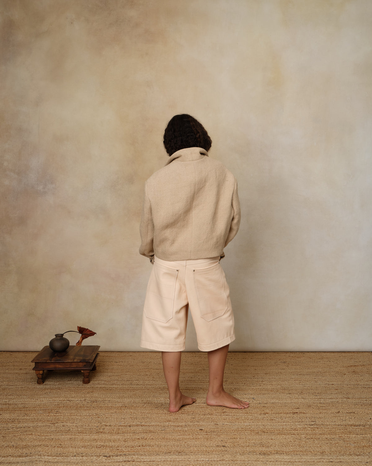 Colbo Big Pocket Leather Shorts in pale ale leather, on model, back view