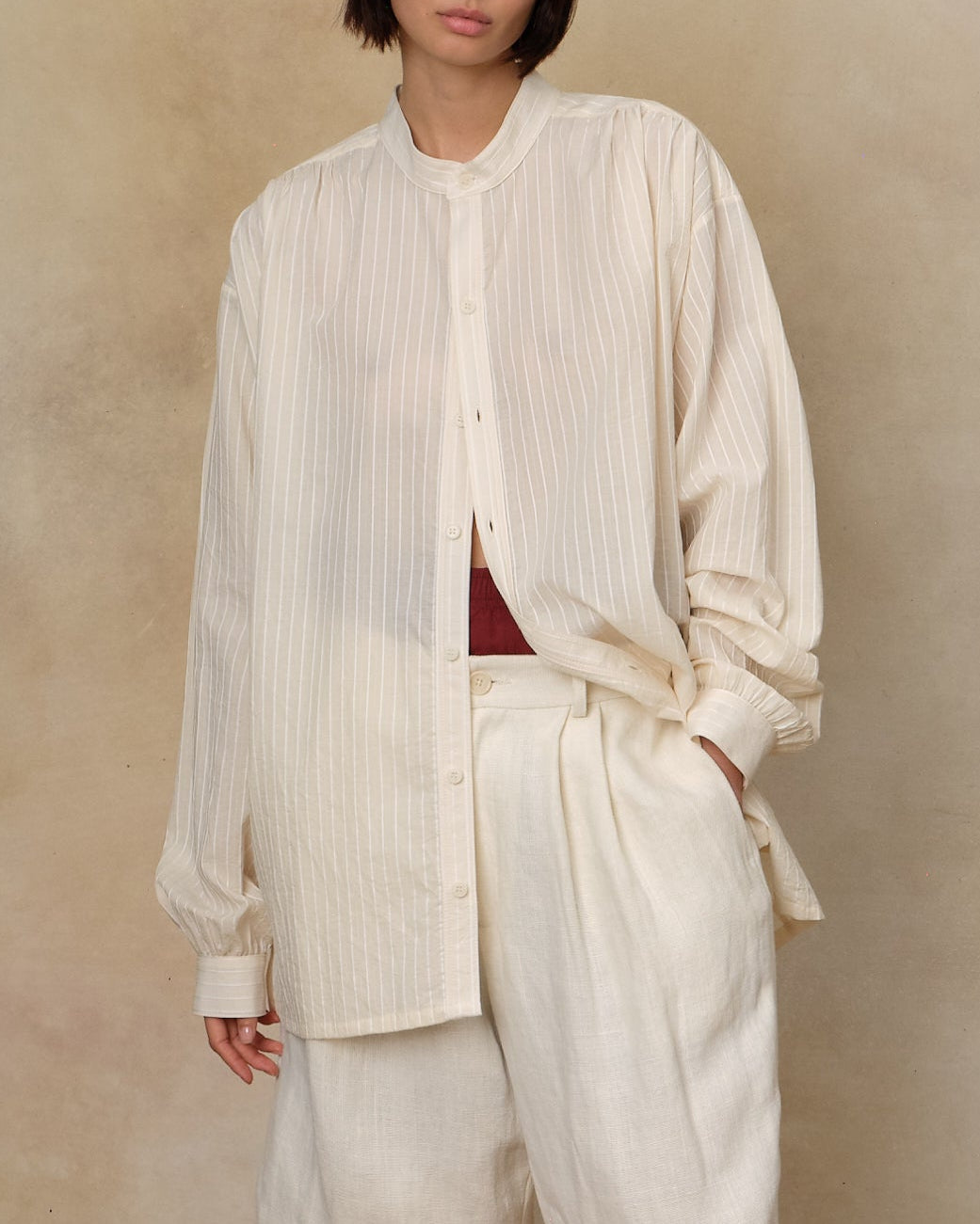 Colbo Krishna Shirt in ivory stripe cotton, on model, worn with matching pants