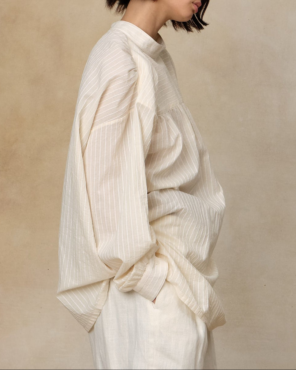 Colbo Krishna Shirt in ivory stripe cotton, on model, side view