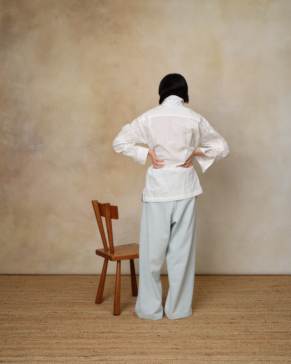 Colbo Crinkled Shirt in white textured cotton, on model, back view