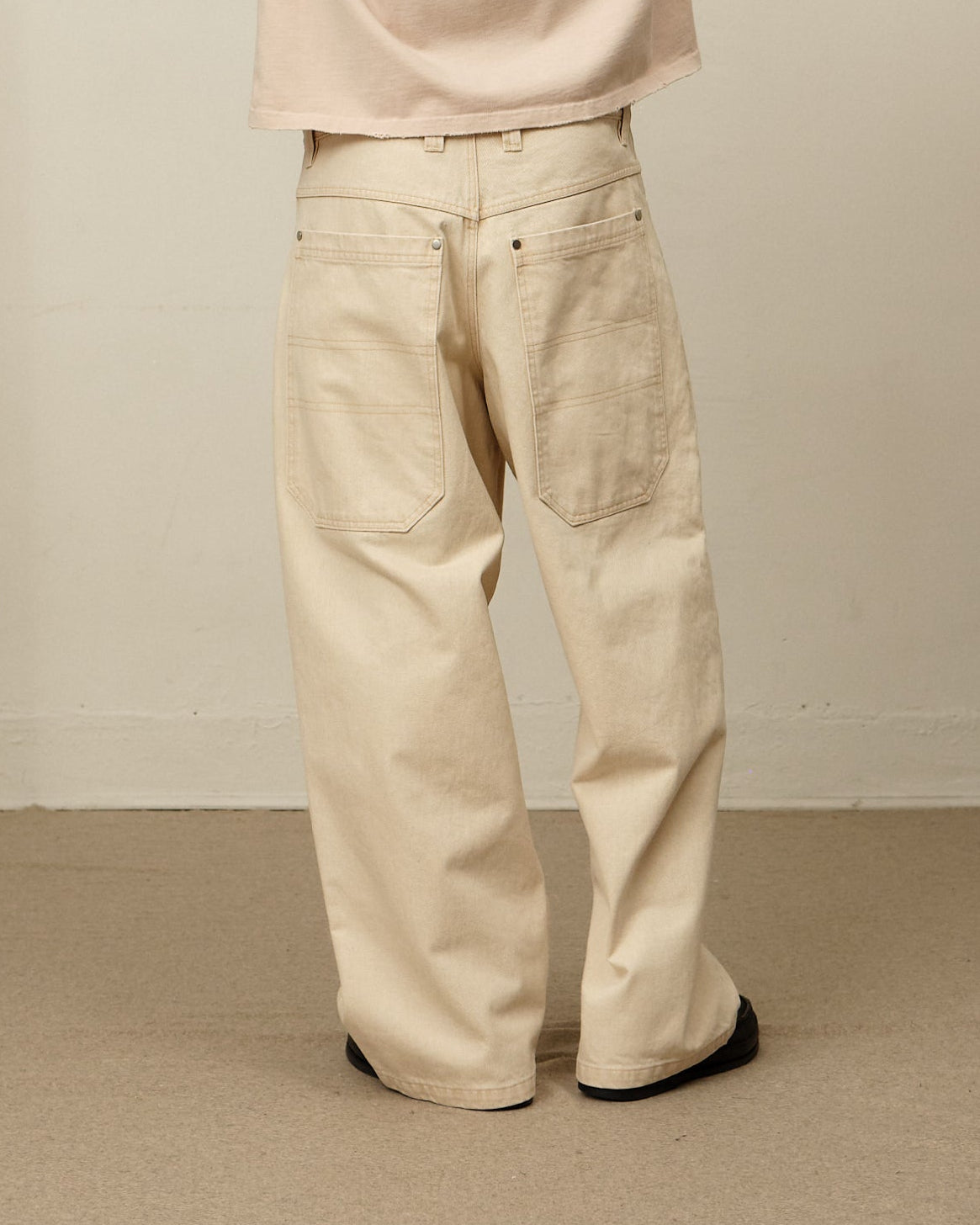 Colbo Big Pocket Denim in peach Japanese denim, on model, back view
