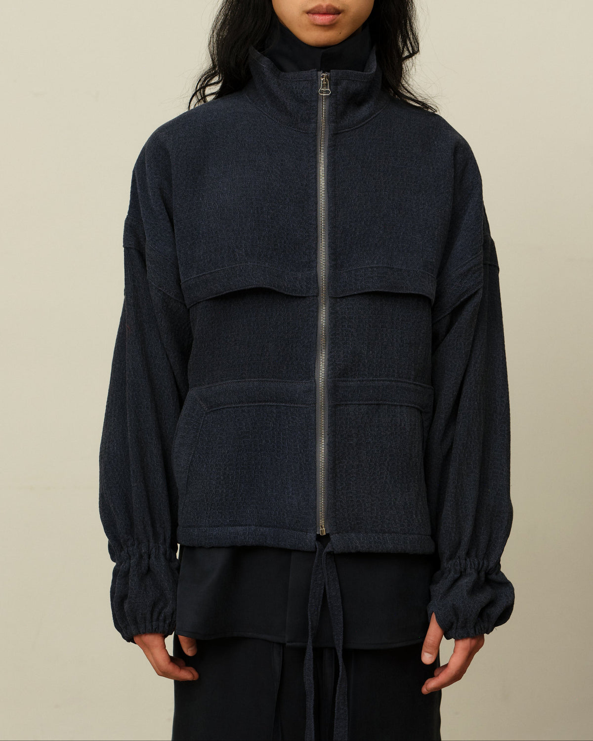 Colbo Mel Jacket in faded blue on model, front, zipped