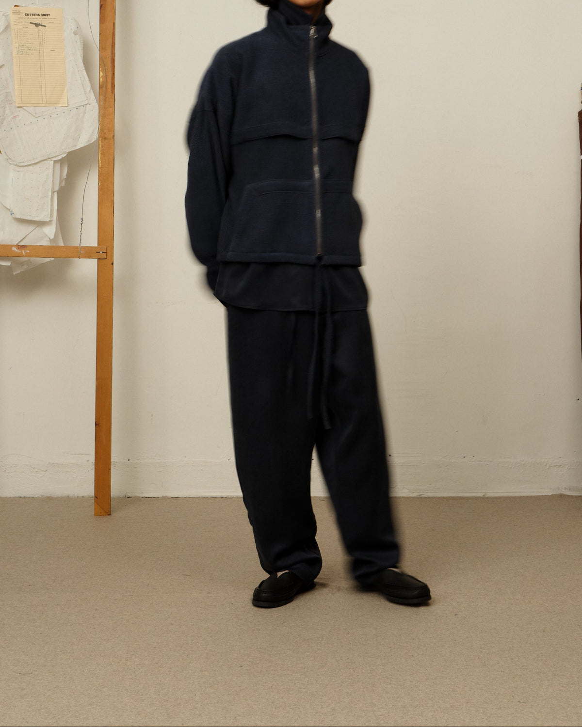 The Colbo Mel Jacket in Faded Blue, full length, with navy trousers