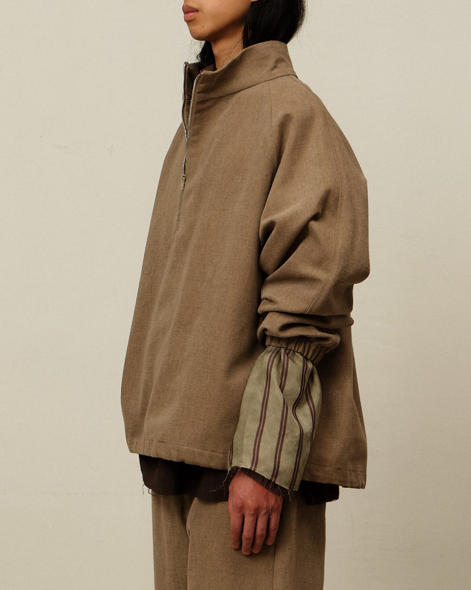 Colbo Half Zip in brushed brown cotton canvas, on model, side view
