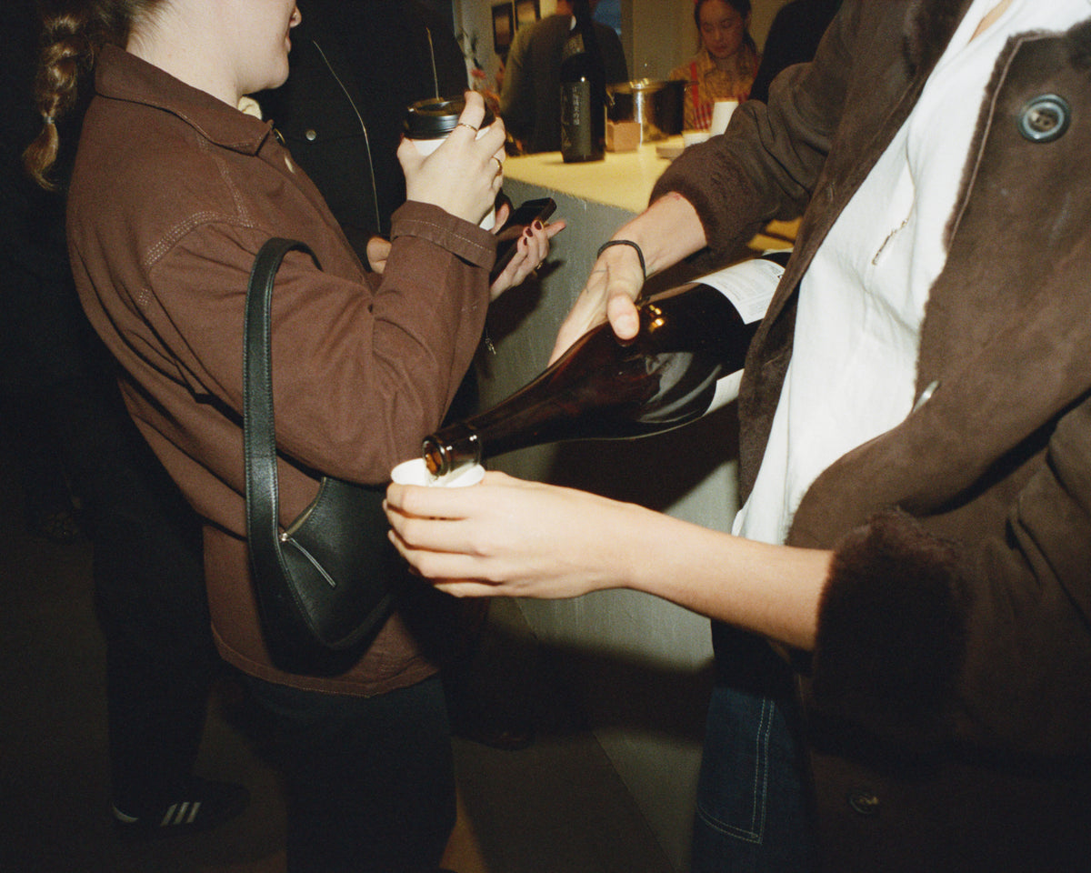 Champagne poured at a Colbo party