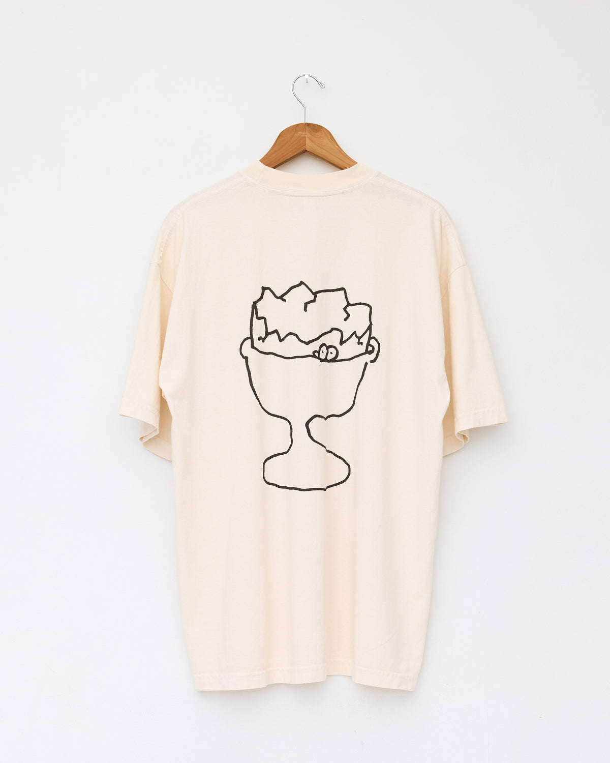 Colbo Frank & Tony graphic T-shirt in cream cotton, back, on a hanger, with hand-drawn graphic