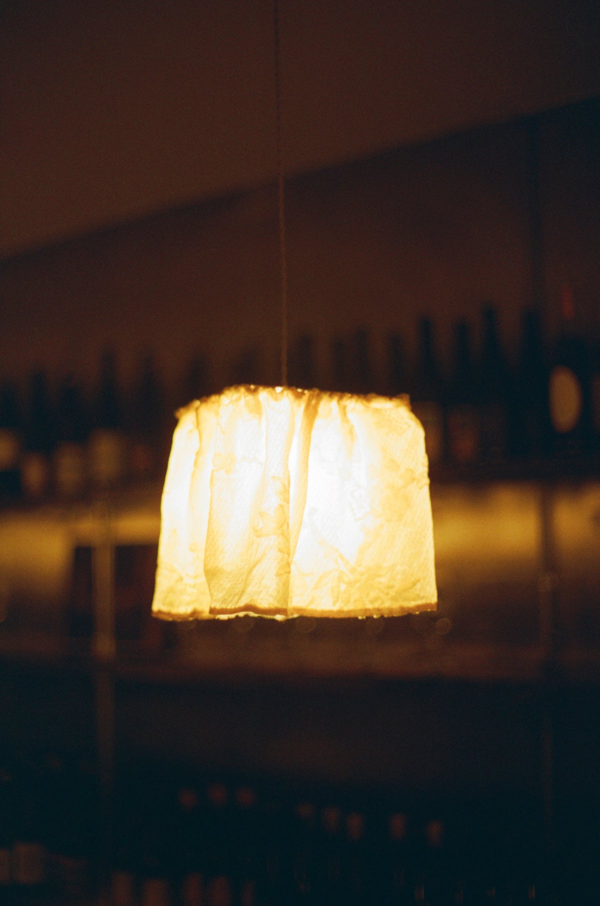 A paper lamp glowing in the dark at Colbo Next Door