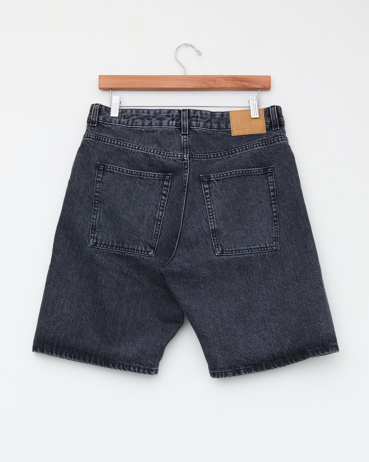Another Aspect Denim Shorts 1.0 in faded black, back, on hanger