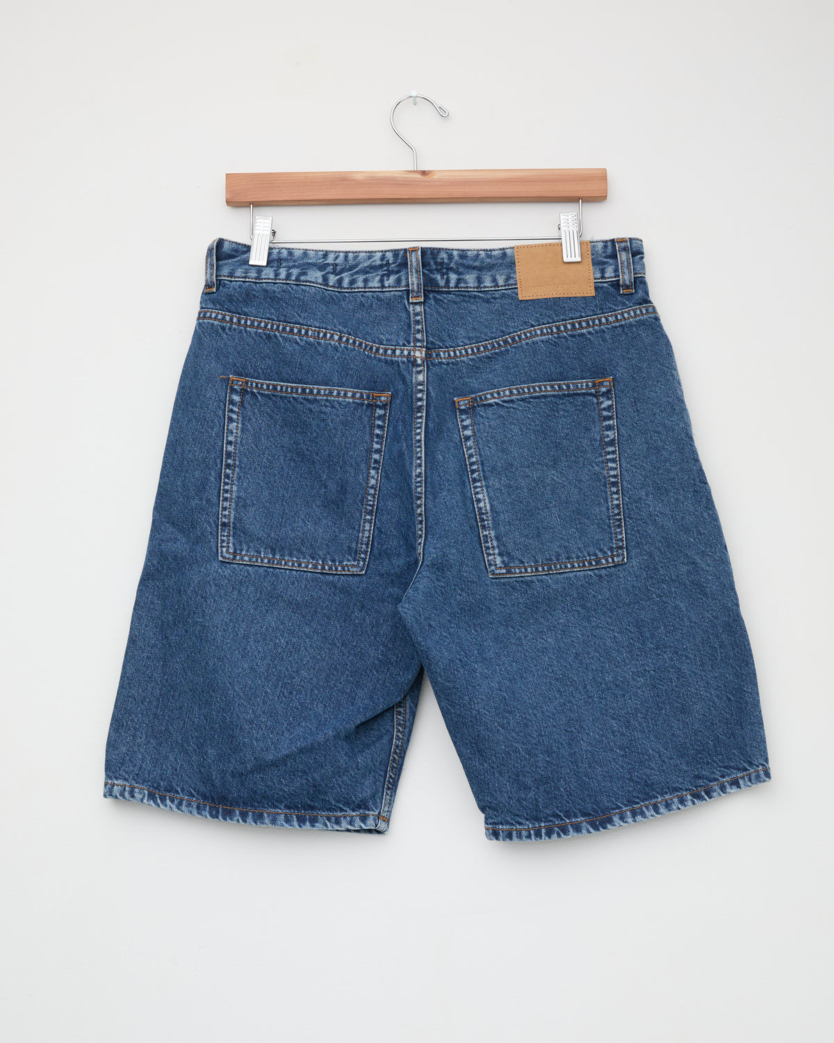 Another Aspect Denim Shorts 1.0 in used blue, back, on hanger