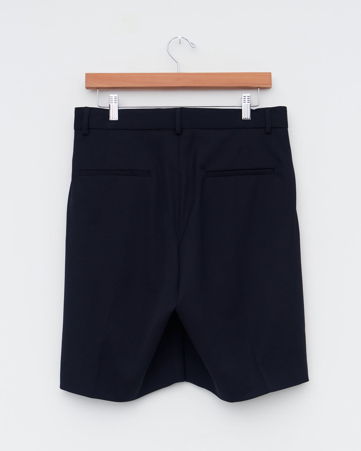 Another Aspect Shorts 1.0 in black wool, back, on hanger