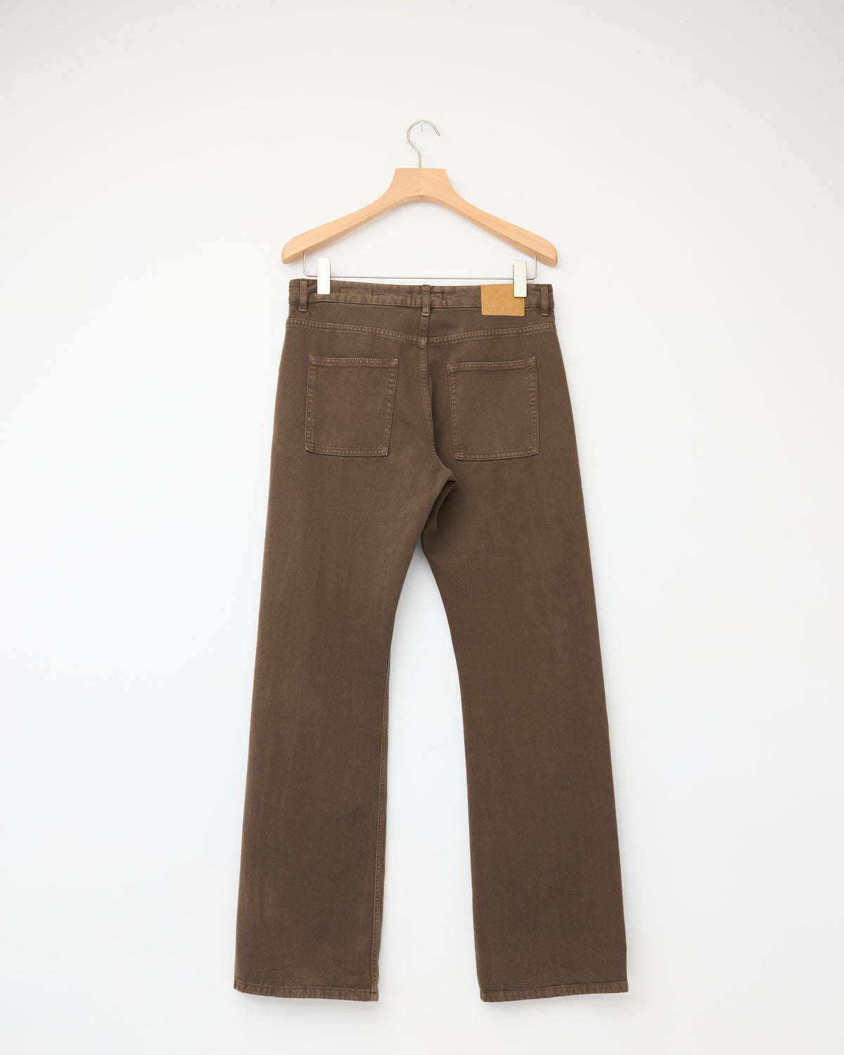 Another Aspect Jeans 3.0 in brown organic denim, back, on hanger