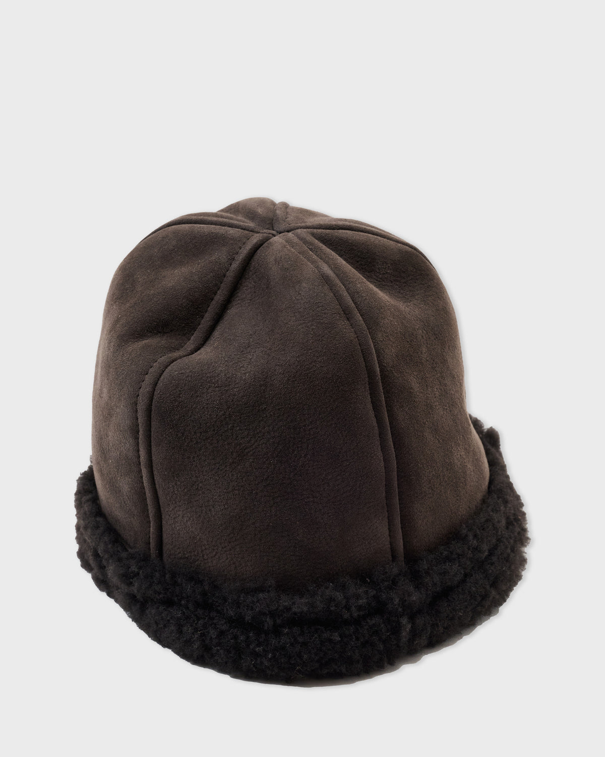 Cawley Francis Cap in brown sheepskin with a curly shearling brim