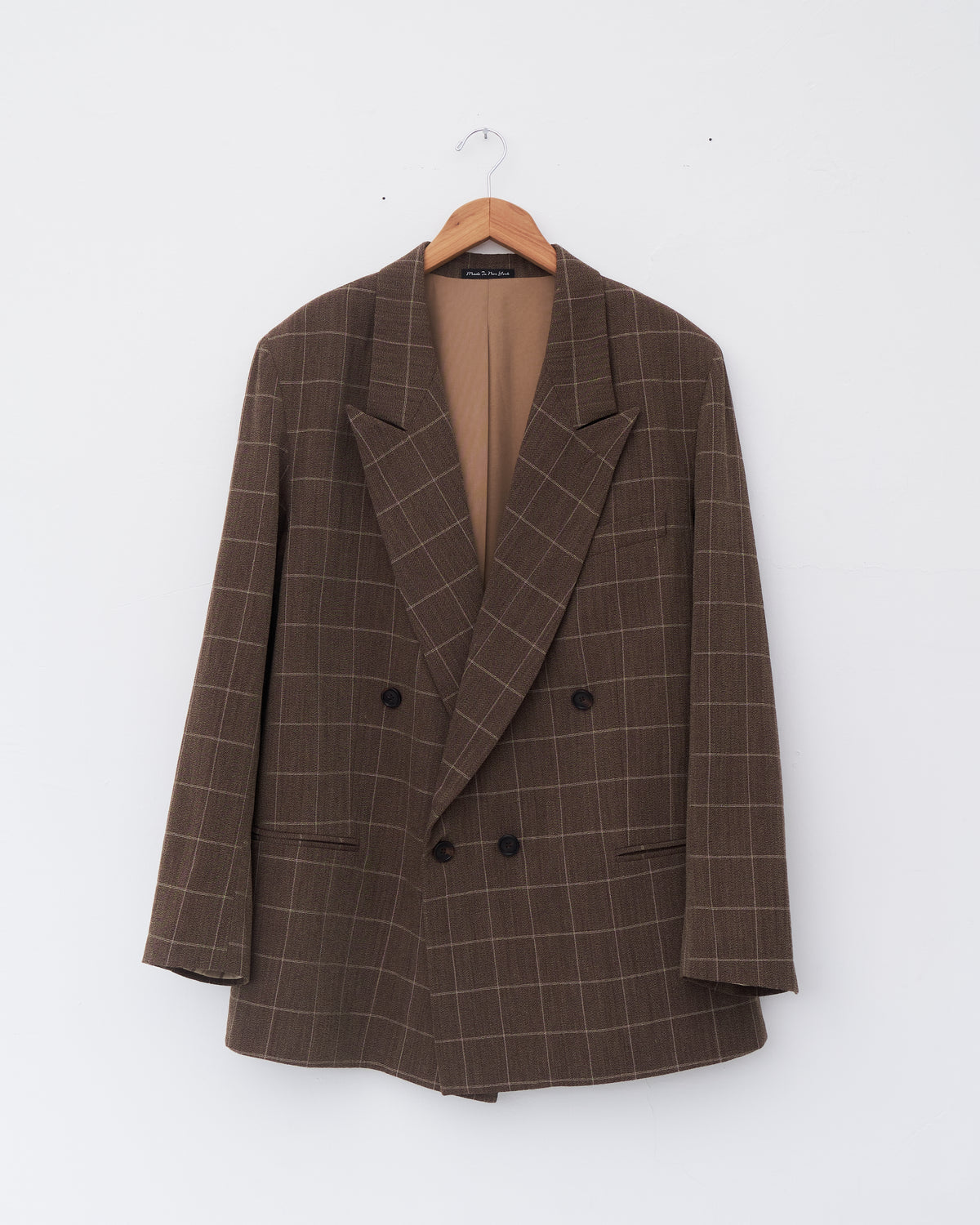 Colbo Double Breasted Blazer in vintage brown plaid Italian wool, front, on a hanger