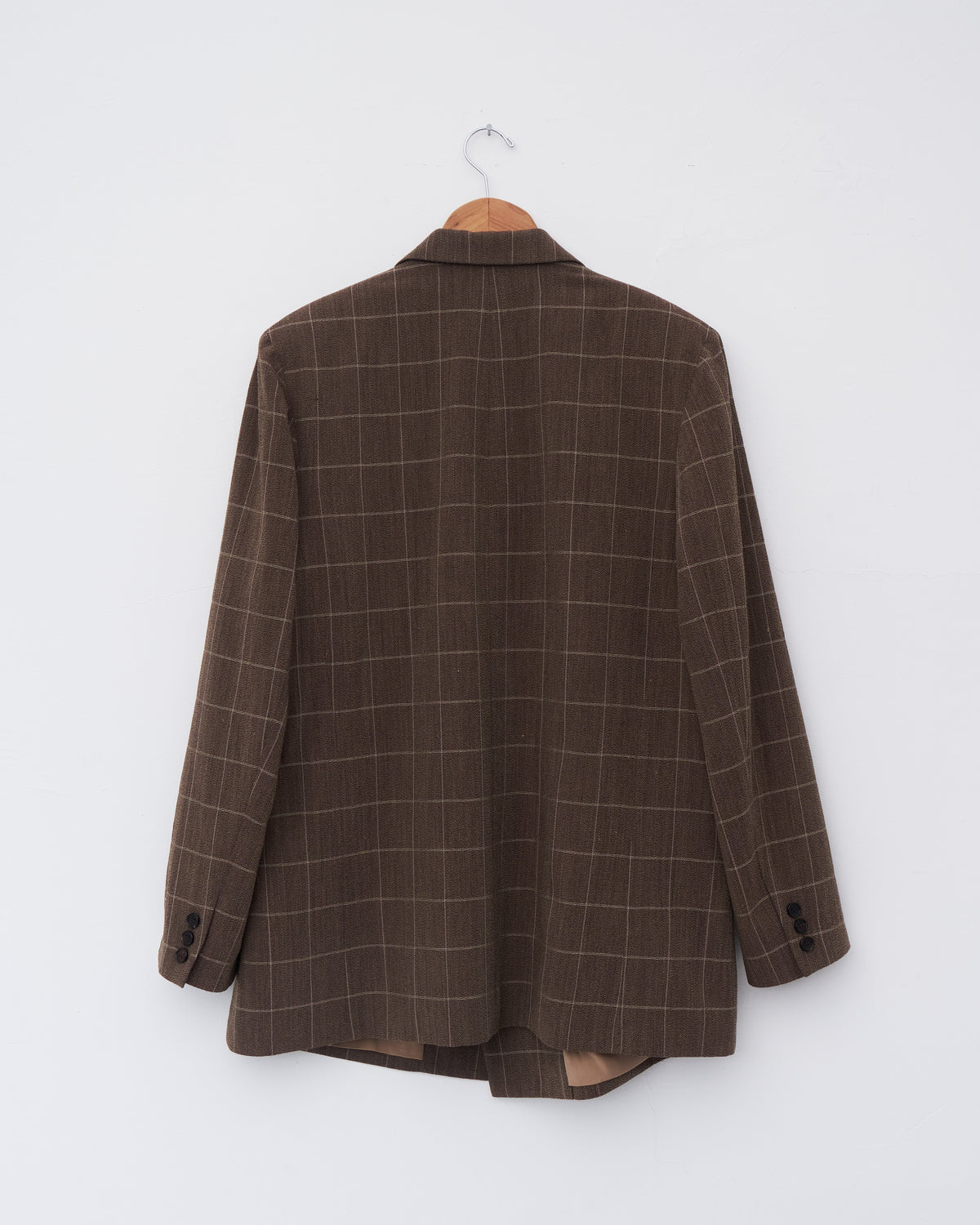 Colbo Double Breasted Blazer in vintage brown plaid Italian wool, back, on a hanger