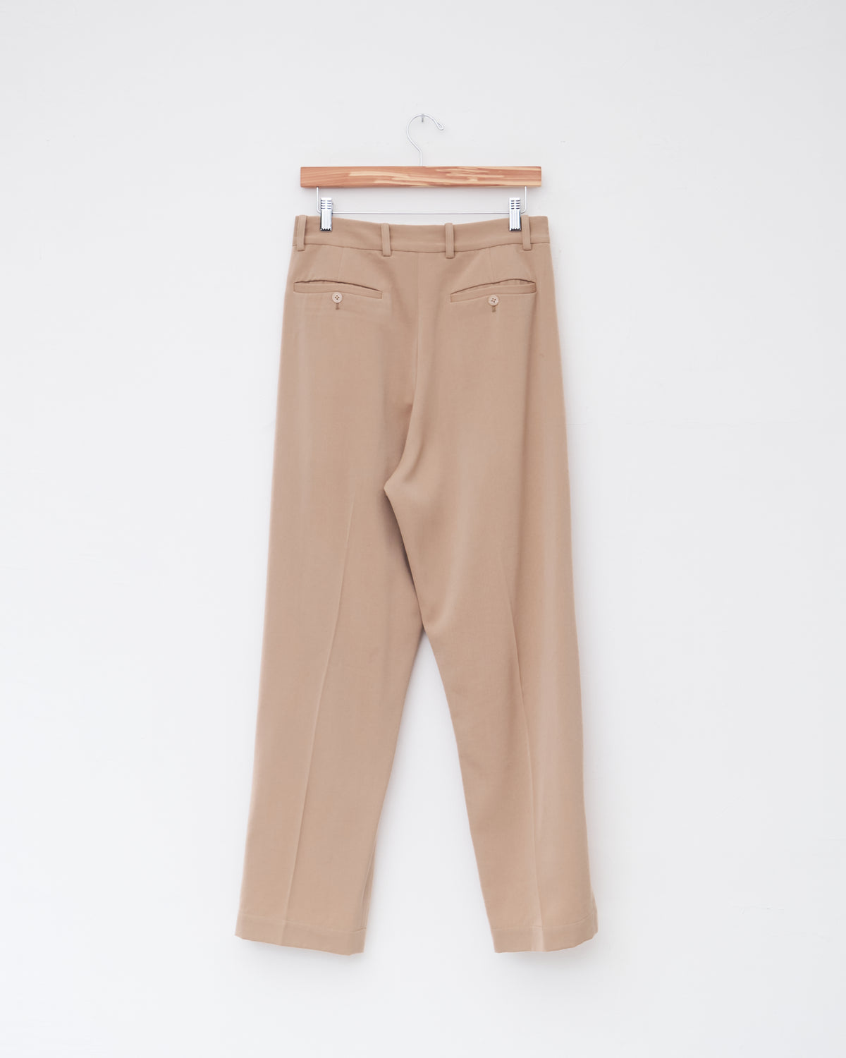 Colbo Suit Pants in light beige wool-viscose, back, on a hanger