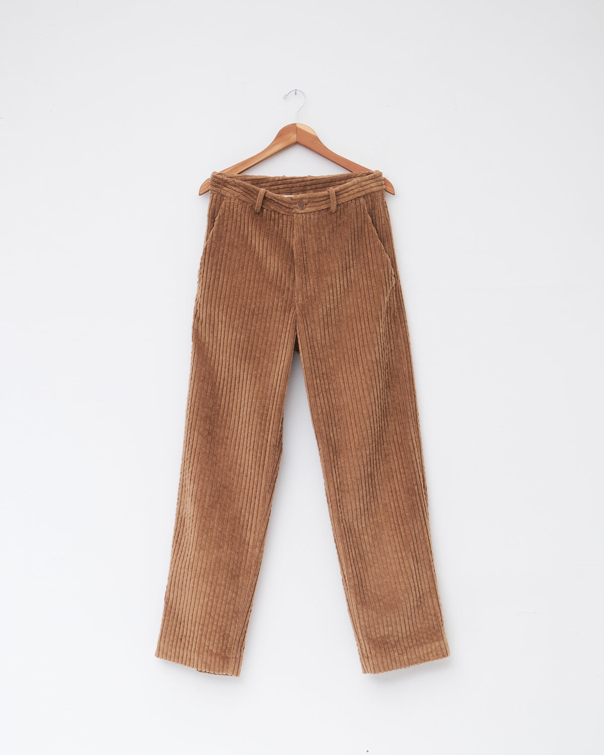 Colbo Wide Cord Chinos in dark tan wide-wale corduroy, front, on a hanger
