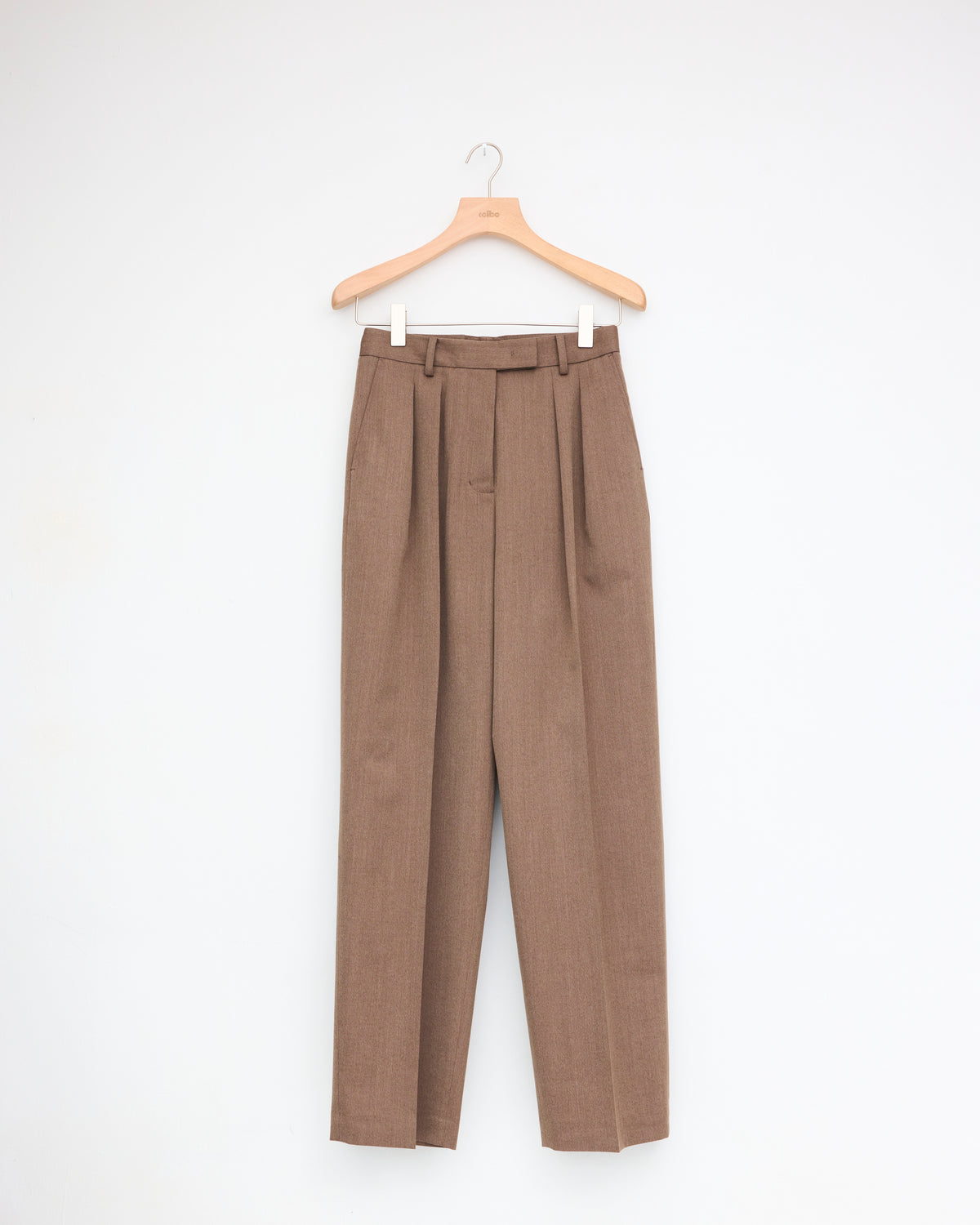 Ernie Palo Wool Pleated Pants in brown, front, on hanger