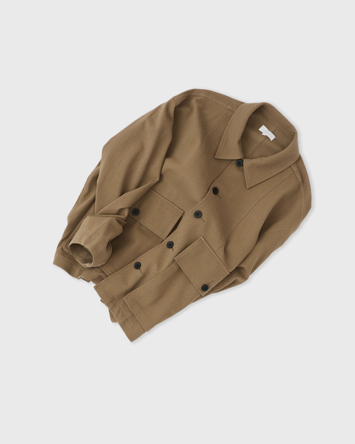 Kanemasa Phil High Twist Work Jacket in khaki cotton, angled flat lay with sleeves folded in