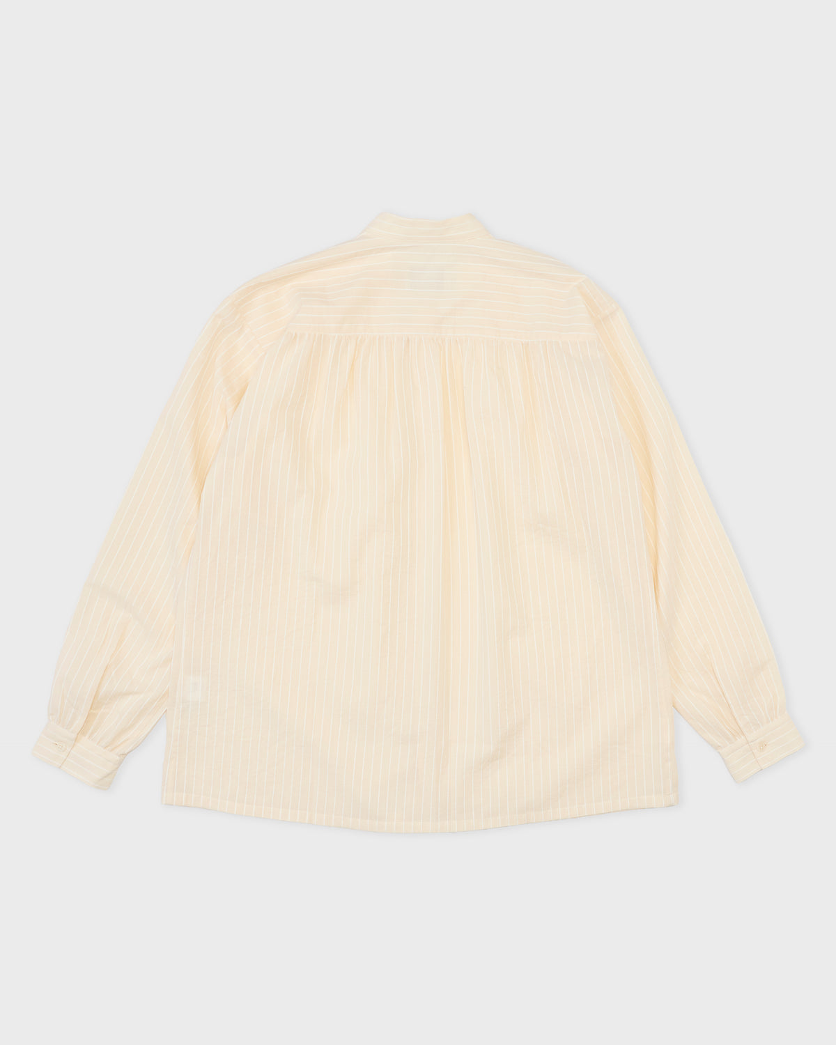 Colbo Krishna Shirt in ivory stripe cotton, back with ruffled gathering, flat lay