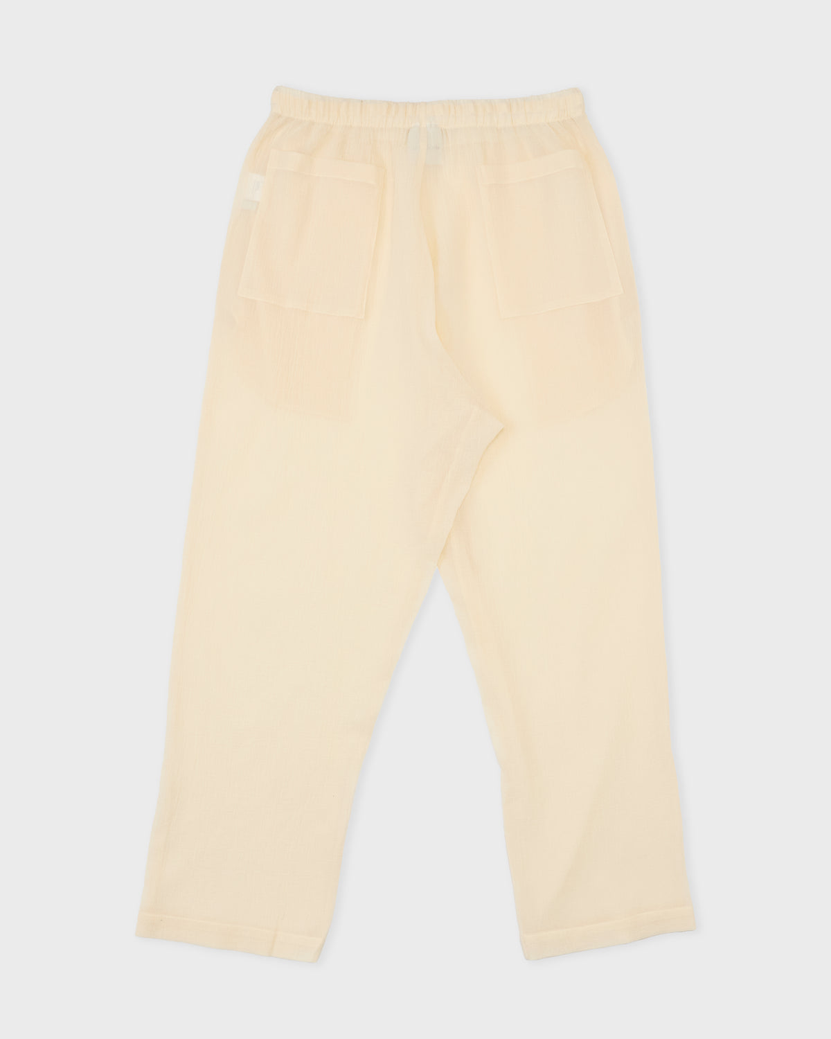 Colbo Light Pants in light sand cotton, back, flat lay