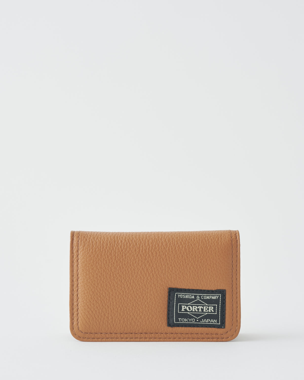 Porter Yoshida & Co. Calm Card Case in camel leather, front with logo patch