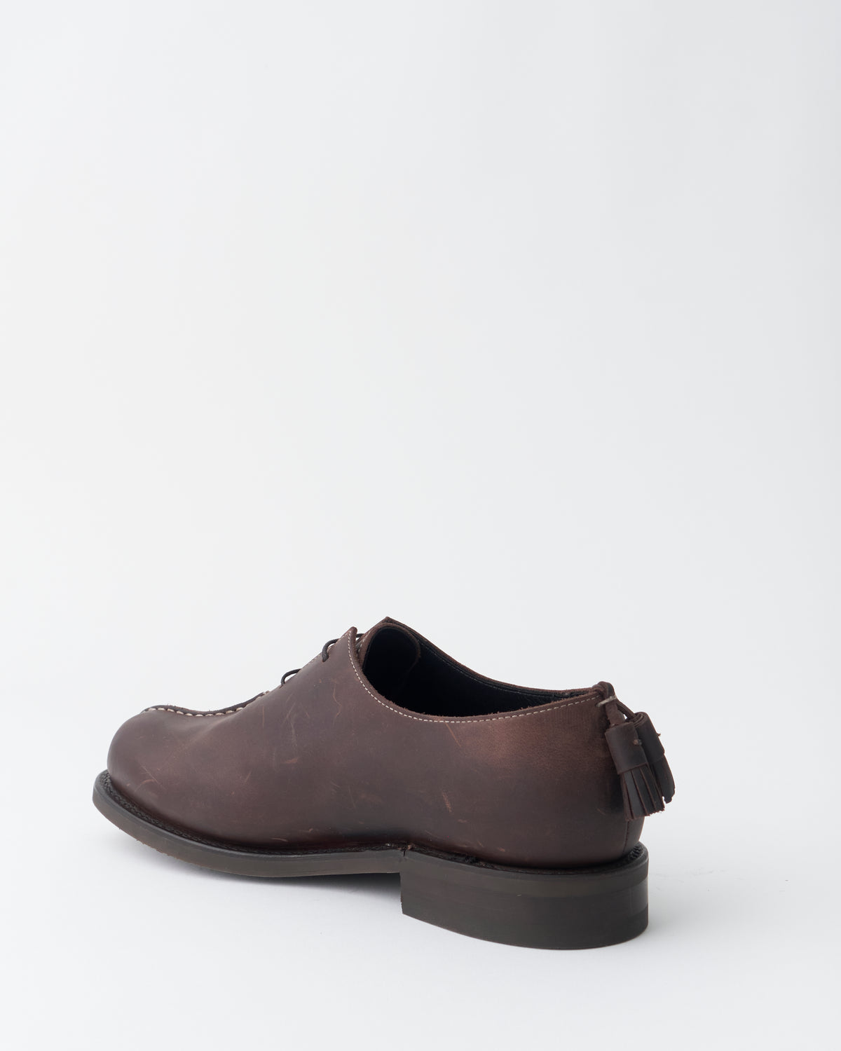 An Irrational Element World Rover Shoe Leather in chestnut, three-quarter back view with heel tassel