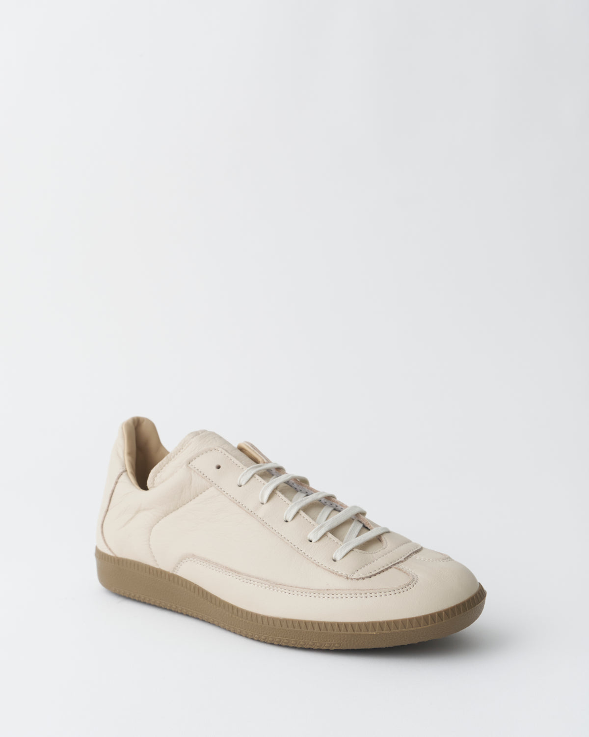 An Irrational Element Sculpture Trainer Leather in off-white, three-quarter view