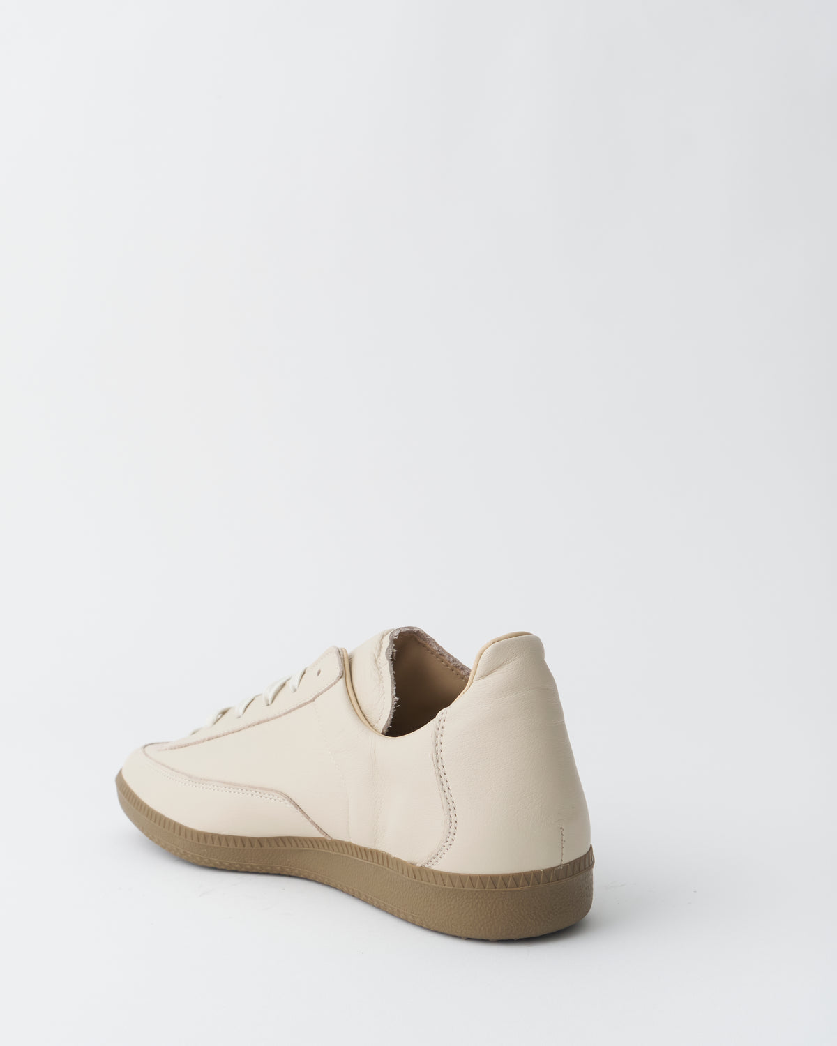 An Irrational Element Sculpture Trainer Leather in off-white, three-quarter back view