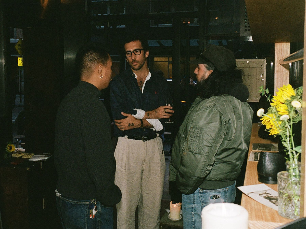 Friends talking at the bar at a Colbo evening