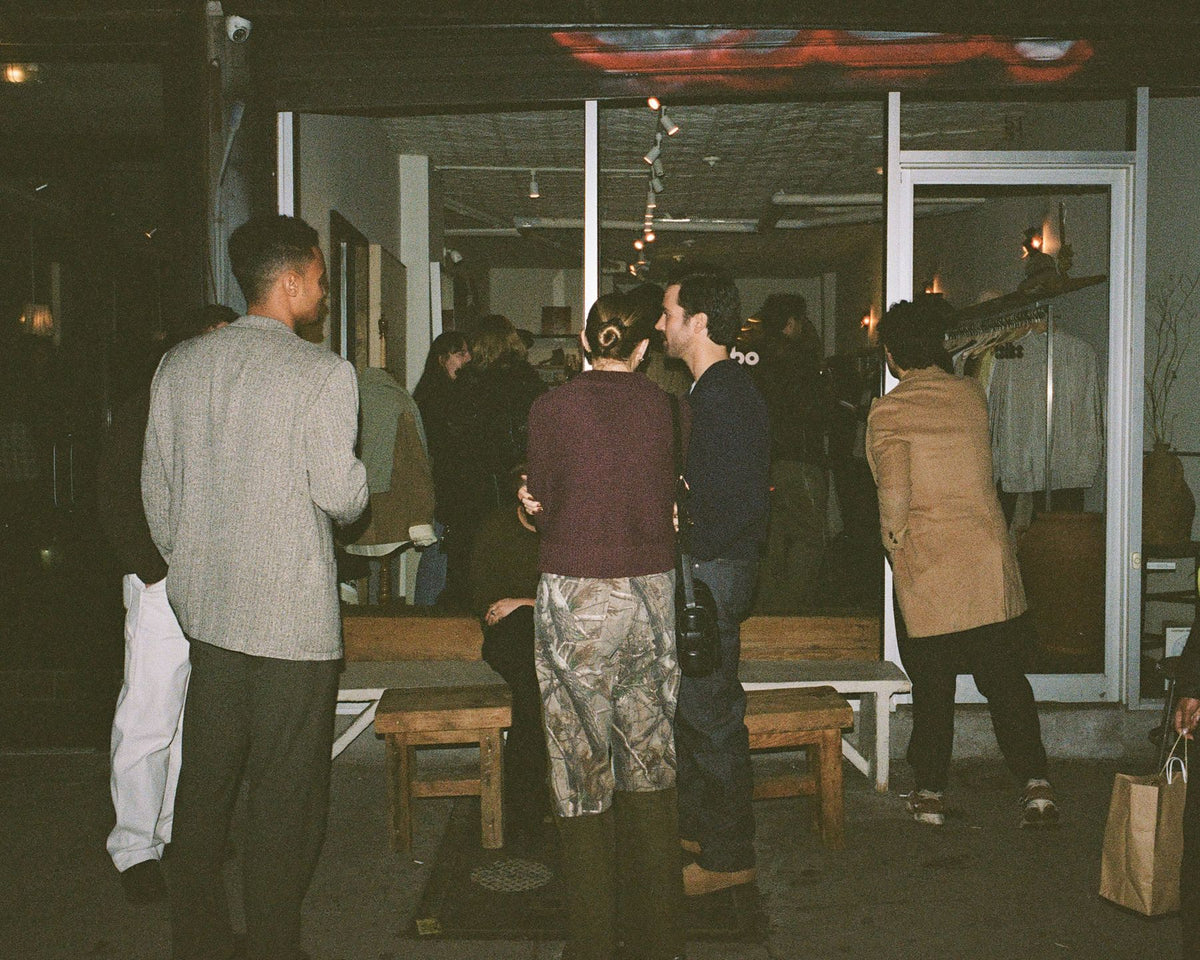 Guests outside 51 Orchard Street at night during a Colbo event