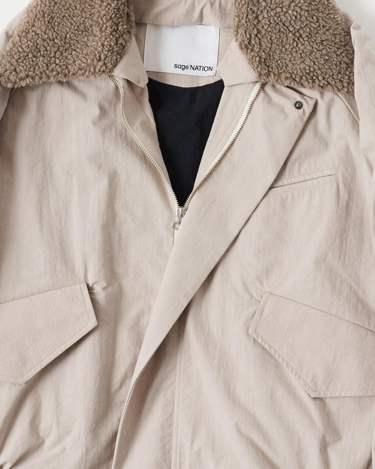 Sage Nation Toya Bomber in light gray cotton-nylon, fleece collar and pockets close-up