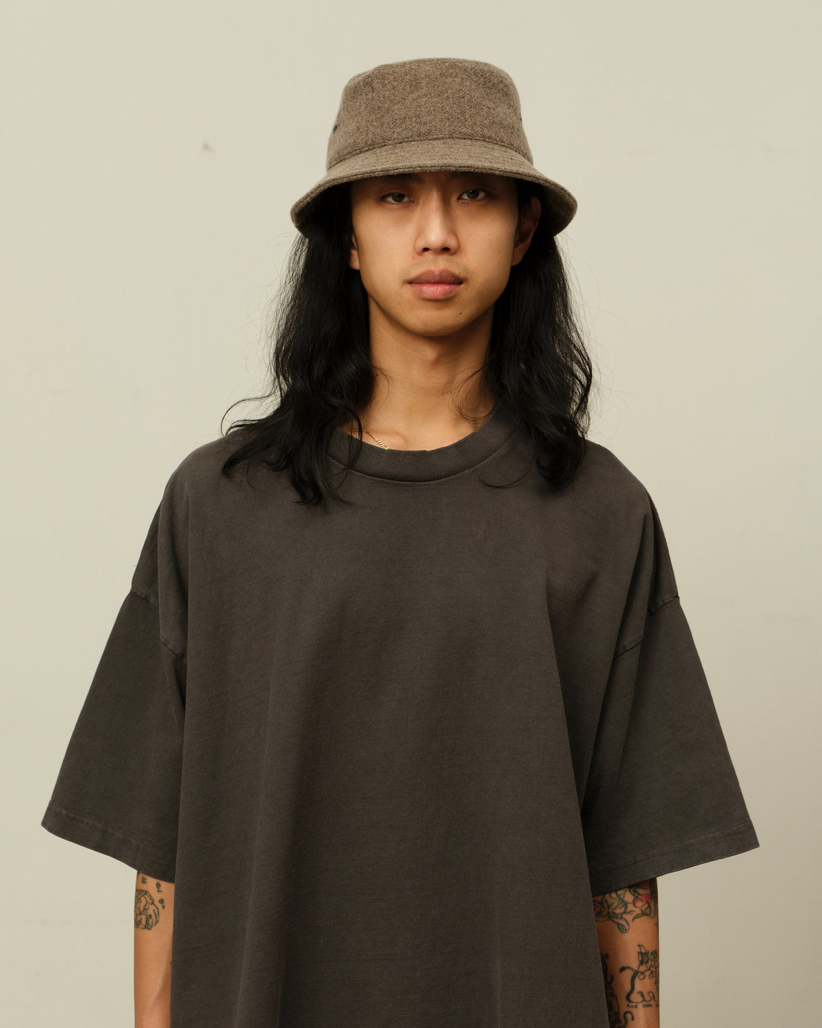 Colbo Bucket Hat in tumble greige, on model, front
