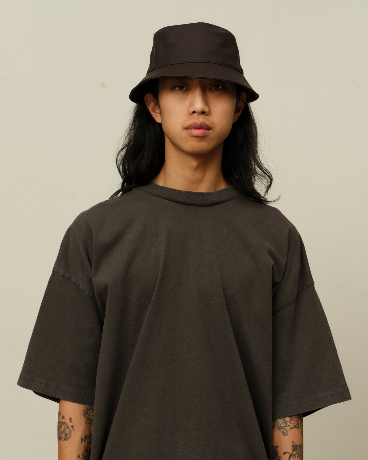 Colbo Bucket Hat in coated deep purple, on model, front