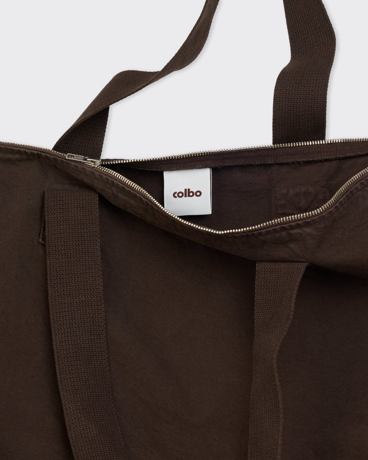 Colbo Zip Tote Bag in soil brown cotton, zip top and Colbo label close-up