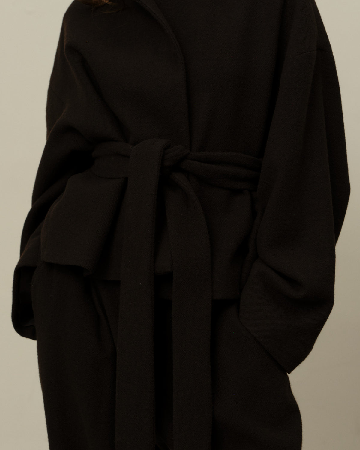 Colbo Omi Jacket in dark plum, on model, belt detail