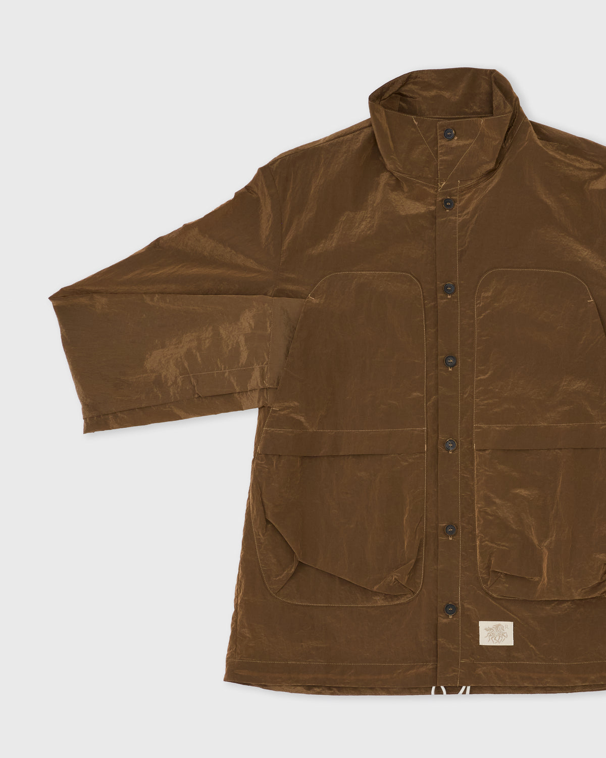 Epitome Shiny Nylon LS Shirt in bronze brown, front pockets and buttons close-up