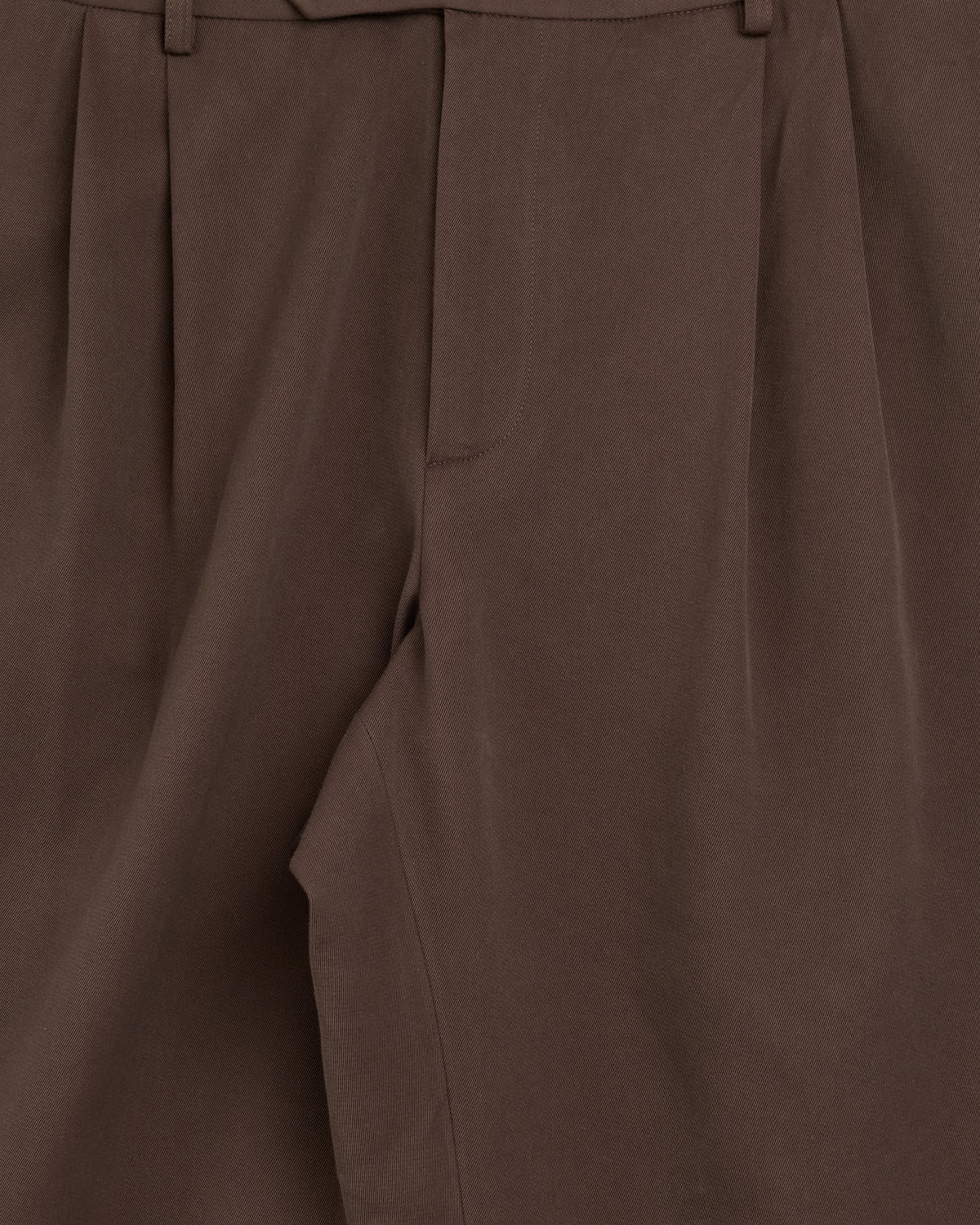 Small Talk Studio Double Pleat Trouser in dark brown, pleat and pocket close-up