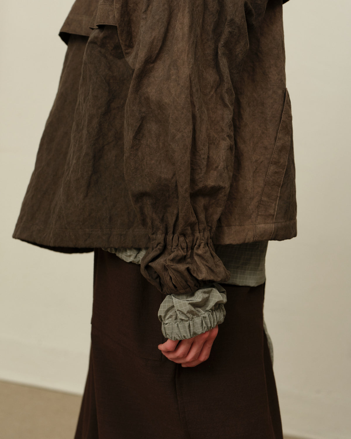 Colbo Mel Jacket in washed brown metal, on model, hem detail