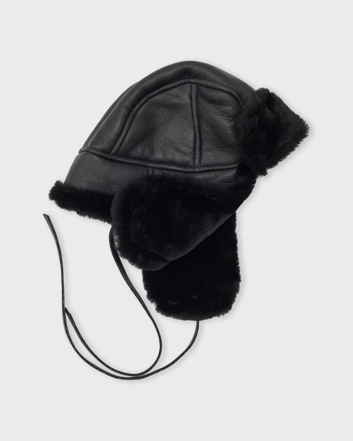 Cawley Leather Back Straight Hair Sheepskin Trapper Hat in black, three-quarter view