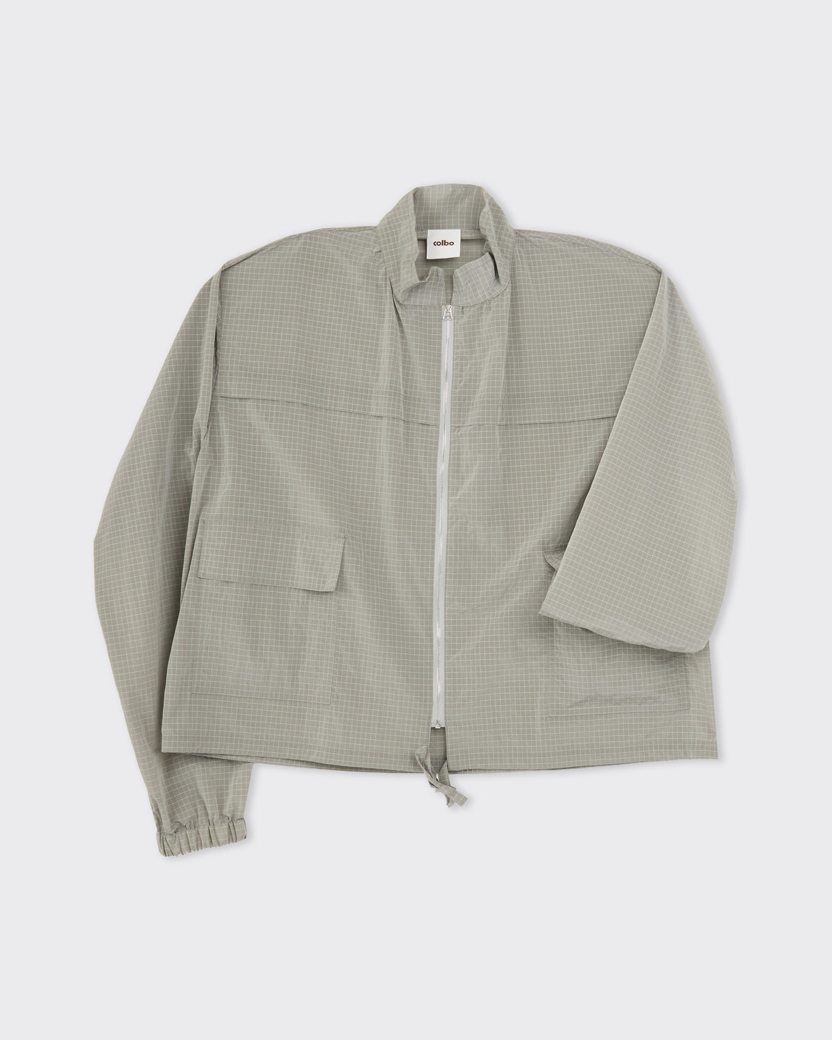 Colbo Track Jacket in sage grid, front detail