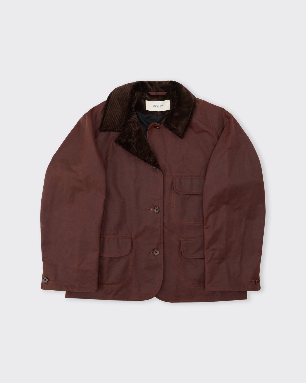Cawley Waxed Oilskin Hunter Jacket in chestnut with chocolate cord collar, three-quarter view