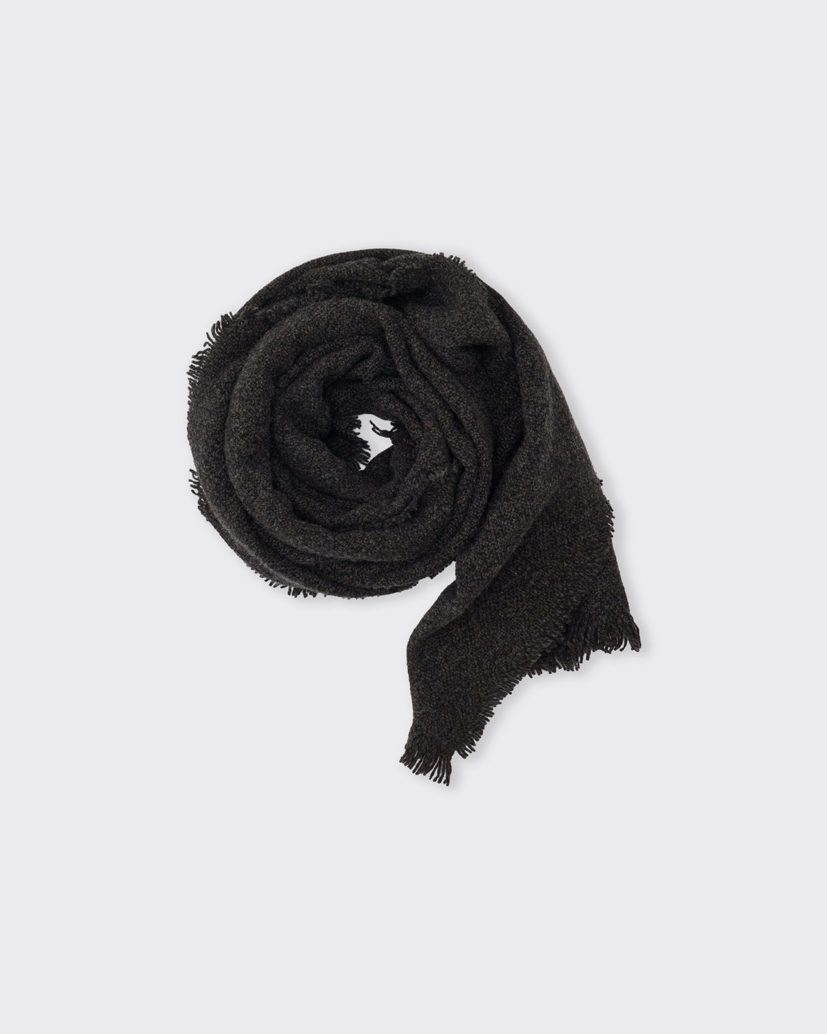 Yoko Sakamoto Wool Long Scarf in black, rolled, top view