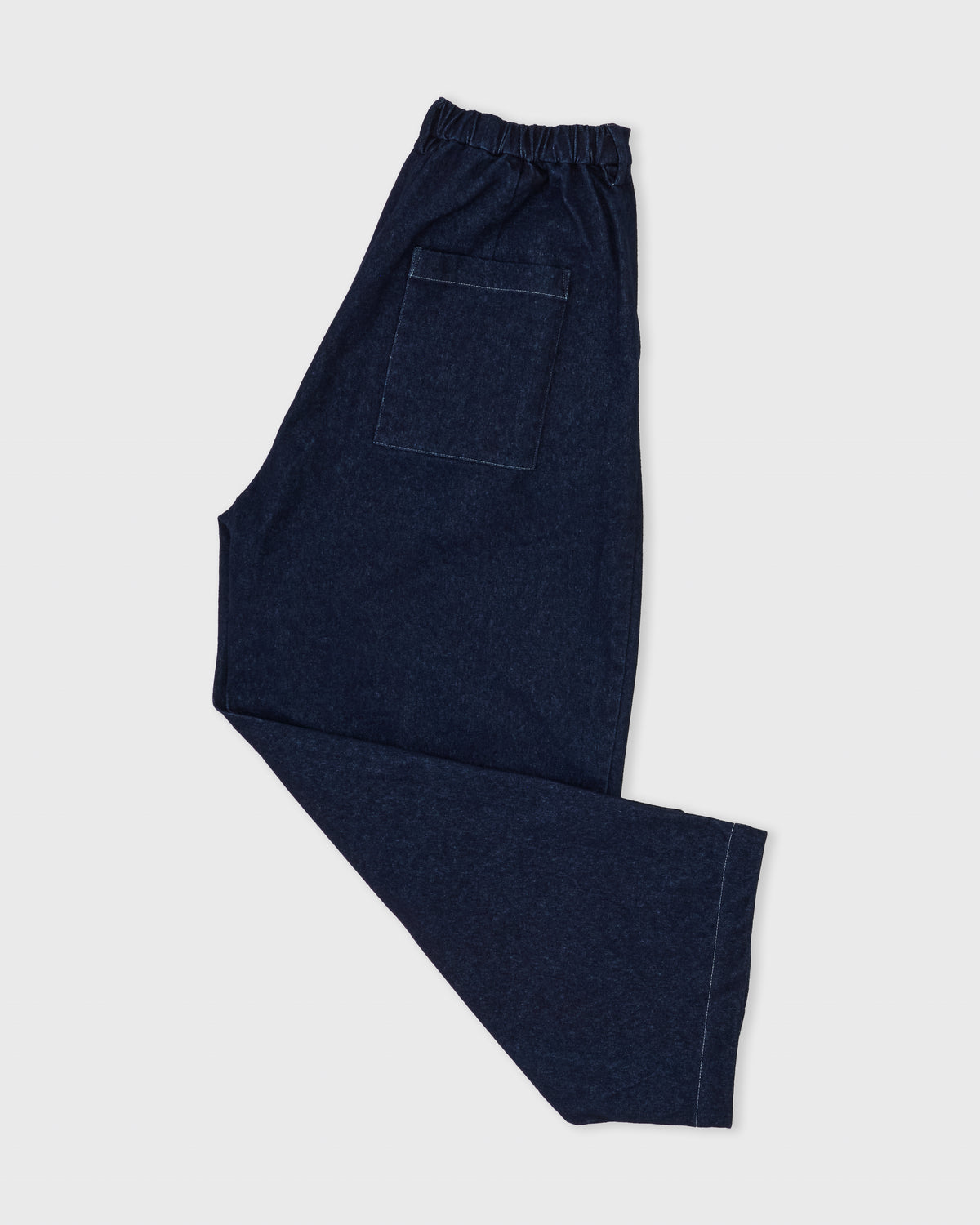 Kanemasa Phil Denim Pants in one-wash indigo, side, folded flat lay with back pocket