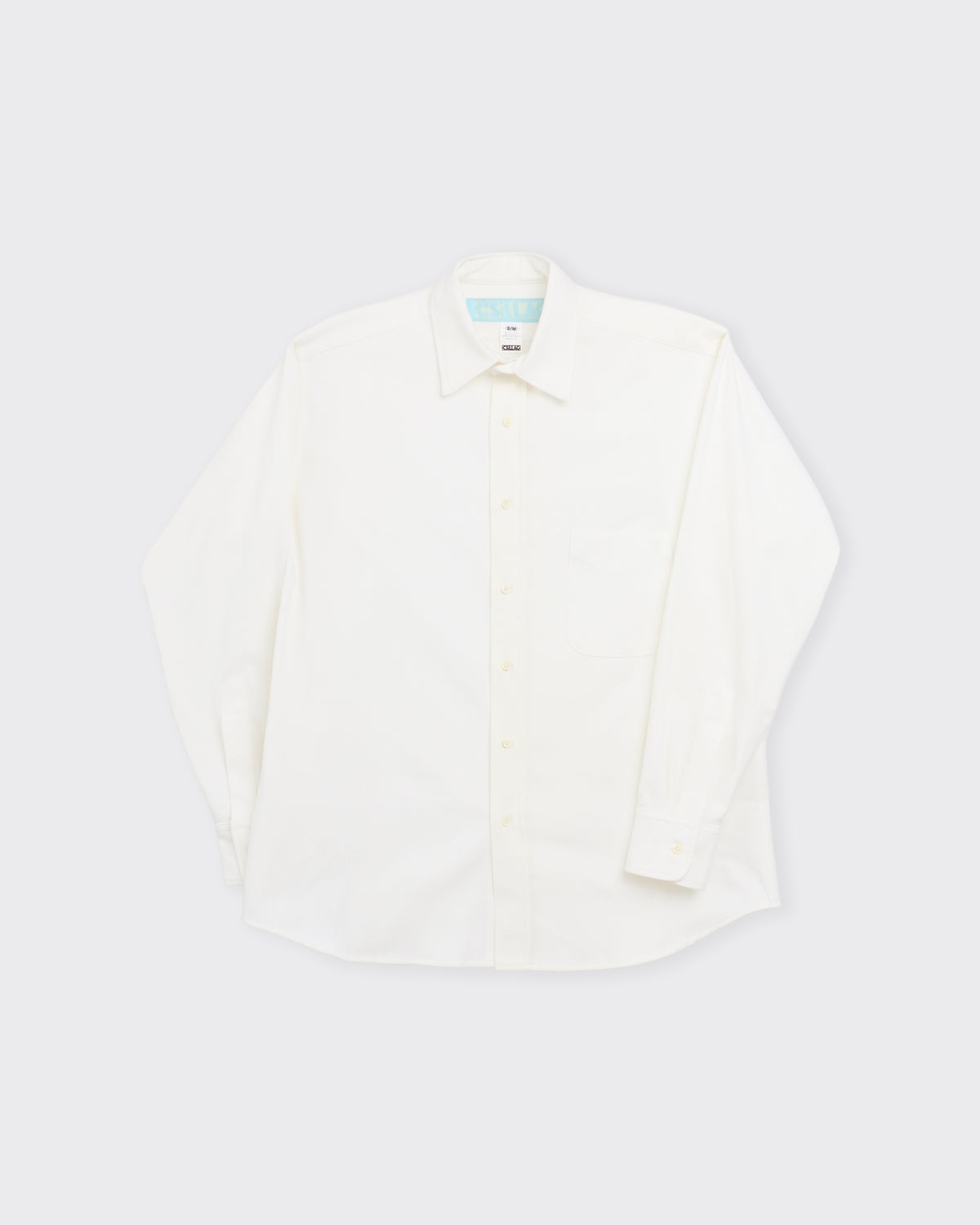 Csillag Slight Brush Cotton Twill Shirt in white, three-quarter view