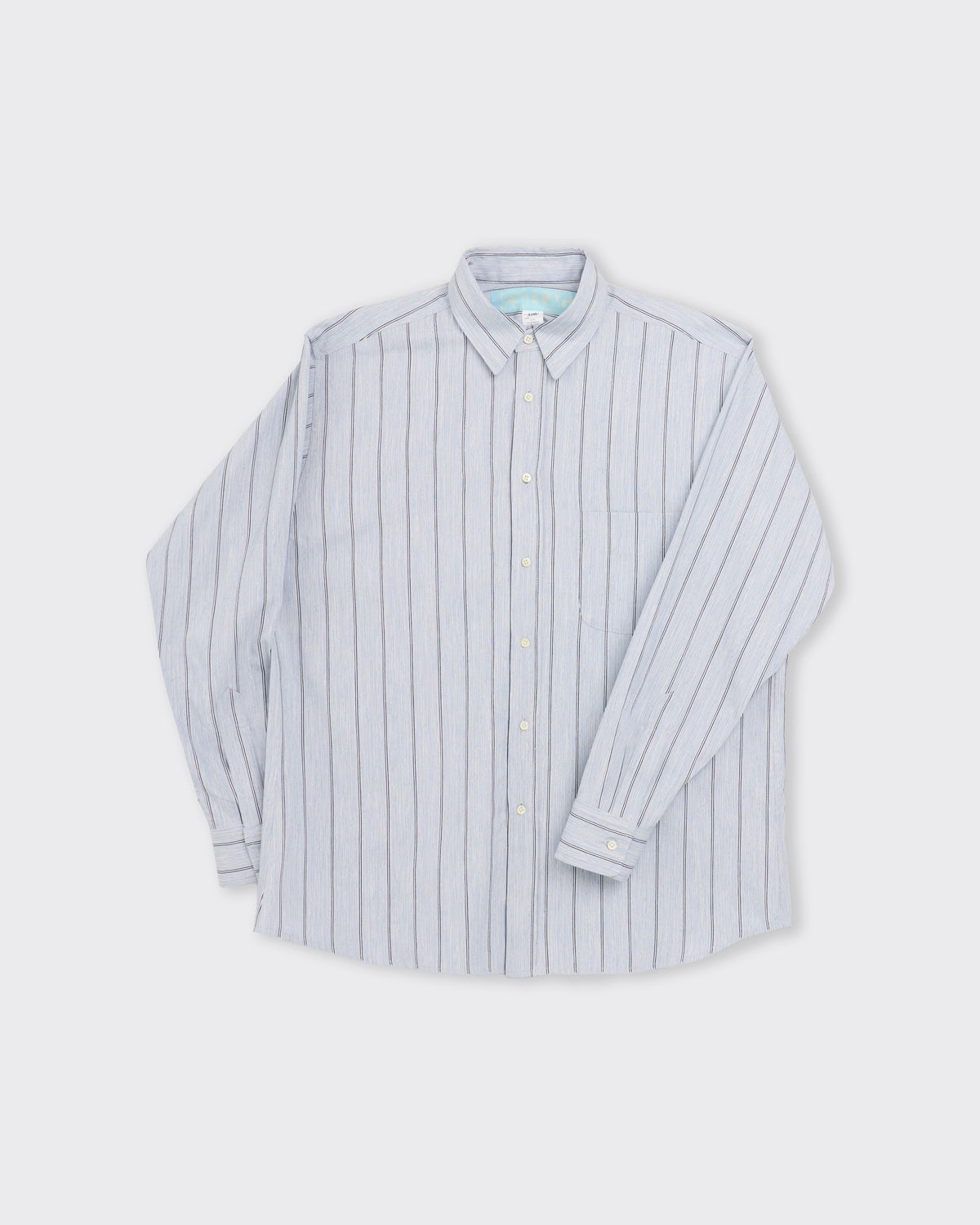 Csillag Stripe Shirt in woodgrain blue, three-quarter view