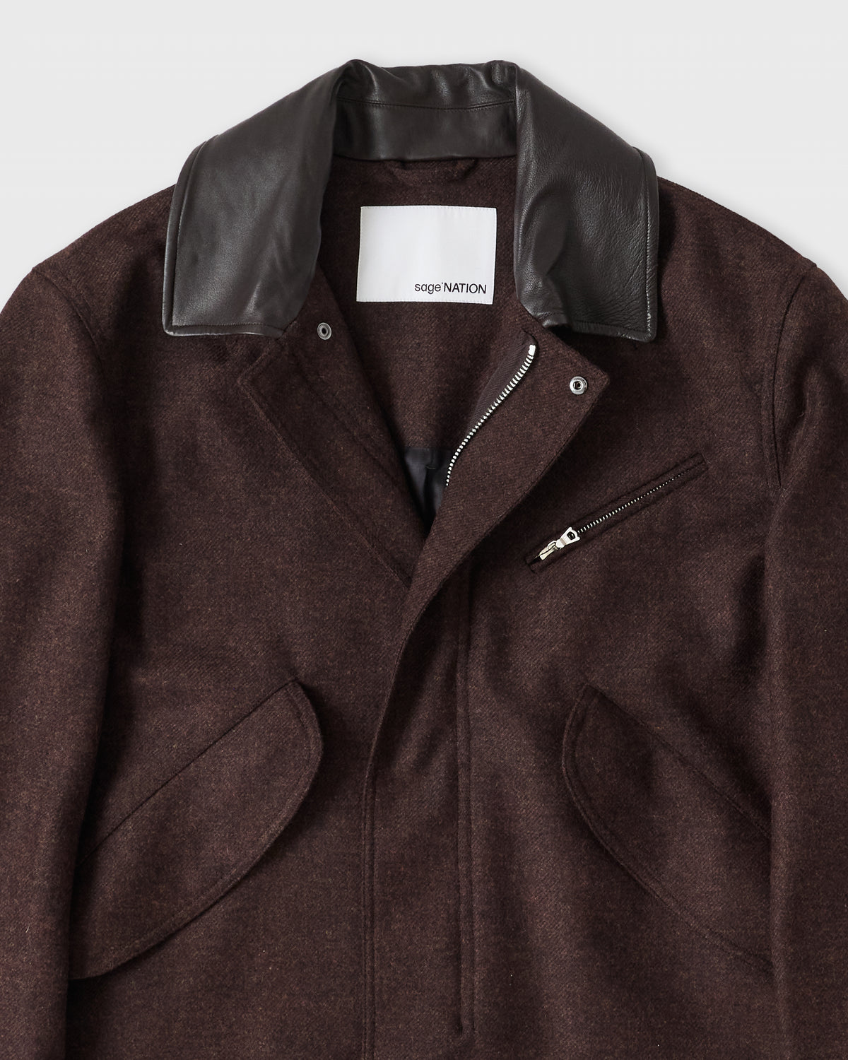 Sage Nation Painter Jacket in mocha brown, leather collar and chest zip pocket close-up