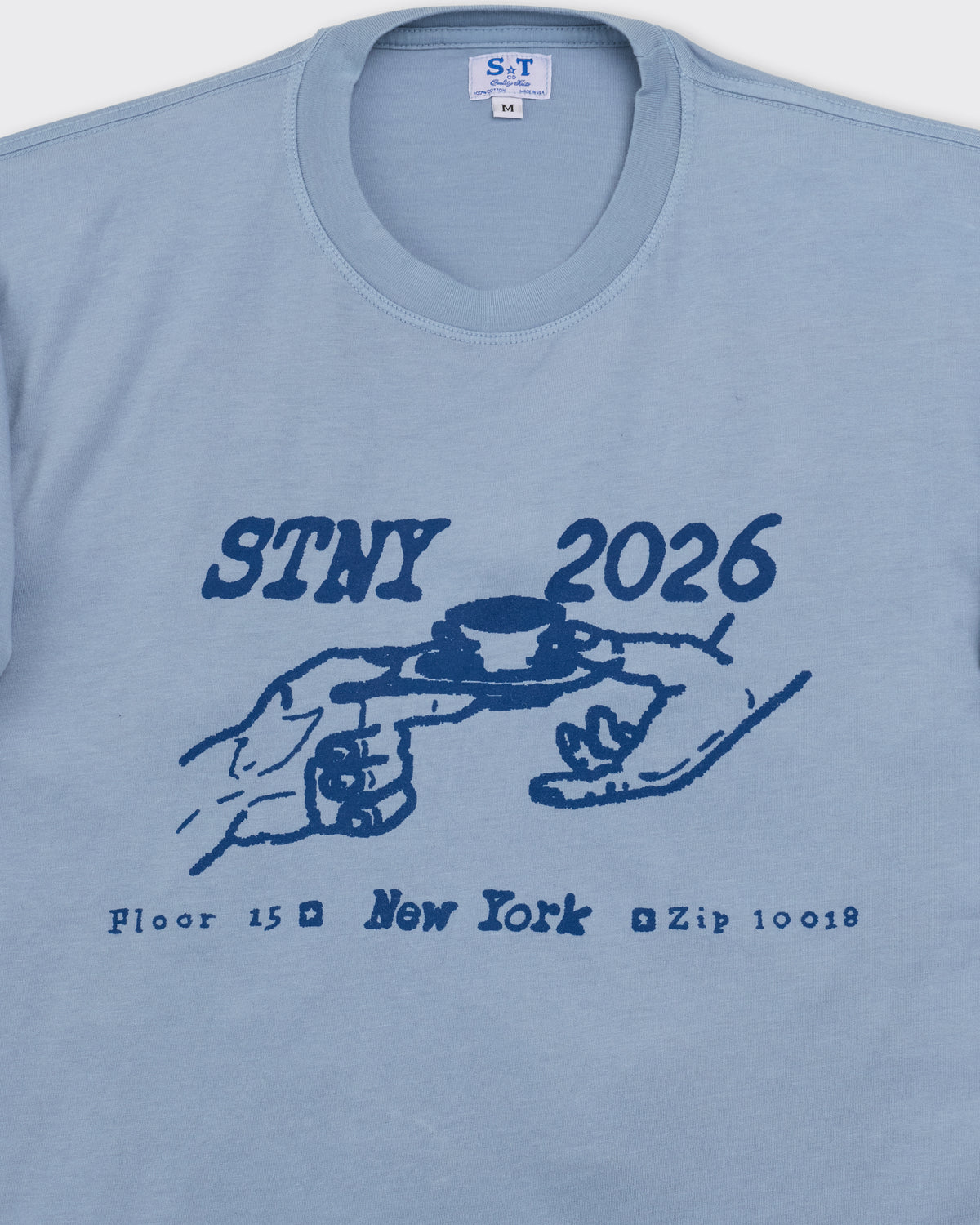 Small Talk Studio Coffee Graphic T-Shirt in starlight blue, chest graphic close-up