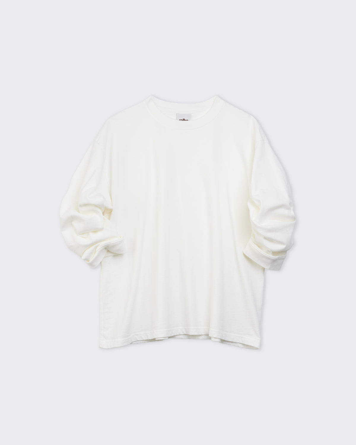 Colbo long sleeve T-shirt in off white cotton, front, sleeves folded, flat lay