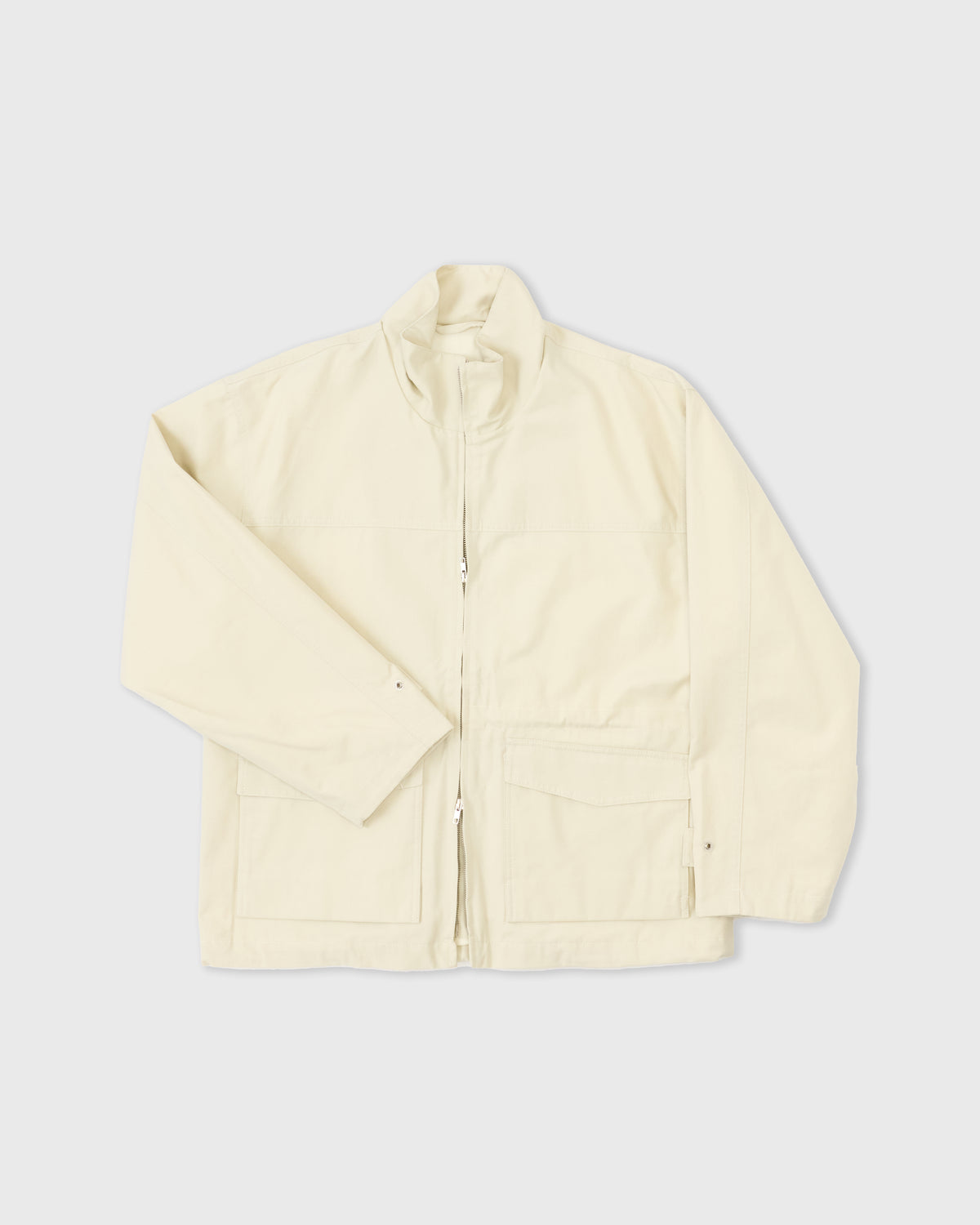 Another Aspect Jacket 4.0 in ecru organic cotton, two-way zip opened from the hem, flat lay