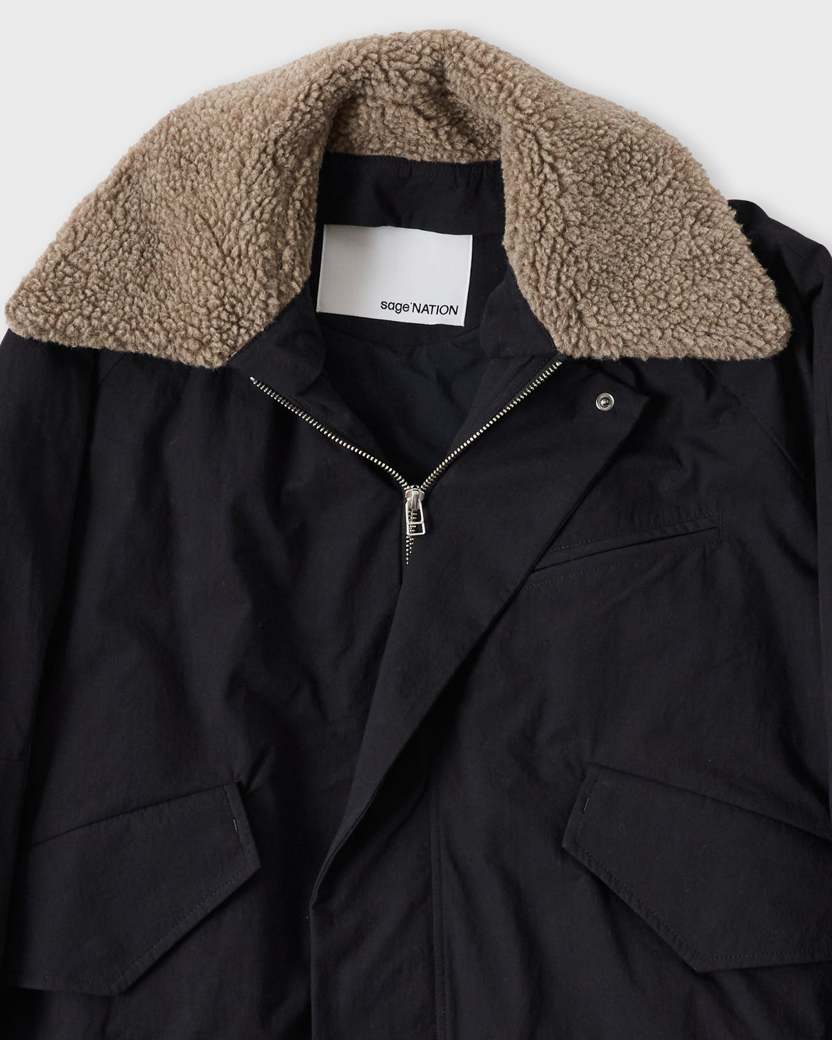 Sage Nation Toya Bomber in dark navy cotton-nylon, fleece collar and zip close-up
